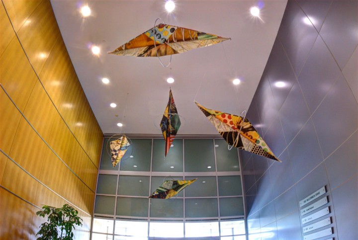These kites grace the lobby of office building in Upper Marlboro, Md. The designers couldn't hang anything on the wood walls, so they took to the ceiling. Image courtesy of Jeffrey Sklaver.