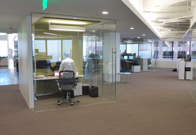 A look at a few of the new glass enclosed, free-address offices at the CBRE HQ. Photo by Bob Fox.