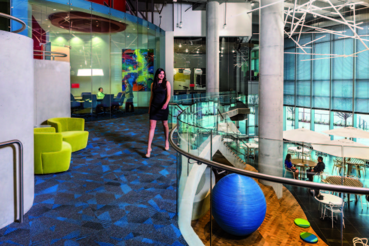 The two story entrance lobby and grand atrium space with views to the wood capped “island” below.