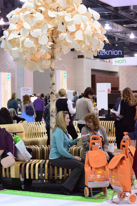 Attendees check out a winding bench by Green Furniture Concept, which prides itself on furnishing indoor public spaces naturally. Photo courtesy of Novità Communications.