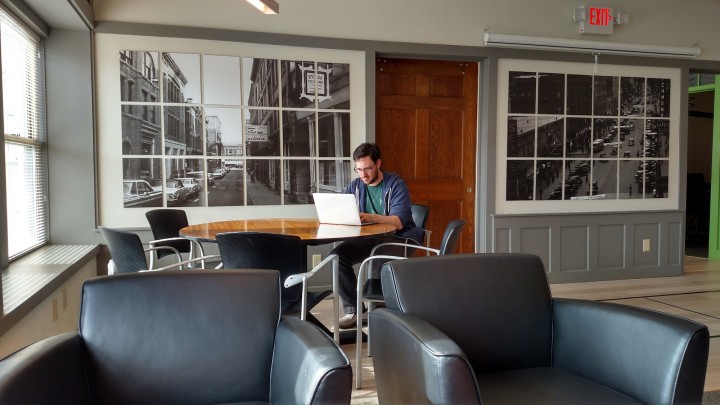 A striking focal point of the space features true "picture windows", displaying vintage photos of North Adams. The wood detailing throughout the space pays homage to the architectural history of the building. Image courtesy of the author.