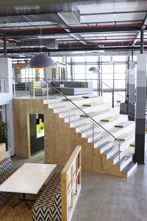 The top of the staircase doubles up as seating for large meetings. Image courtesy of Inhouse.