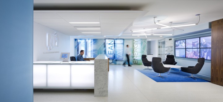 The reception desk at Nuclear Energy Institute's Washington, D.C. office. Daylight glows through blue green translucent panels that emphasize words associated with the nuclear power industry, like “clean”, “air”, and “energy”. Photo by Ron Blunt, courtesy of FOX Architects.