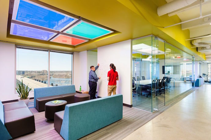 Sweeping views of the nearby James River were a design priority for this colorful office space. Image Courtesy of Ansel Olson.