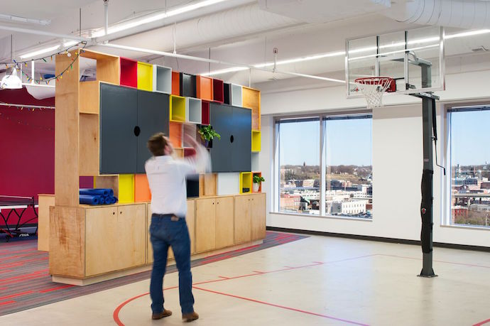 A mini basketball court plays up AvePoint's active team culture. Image Courtesy of Ansel Olson.
