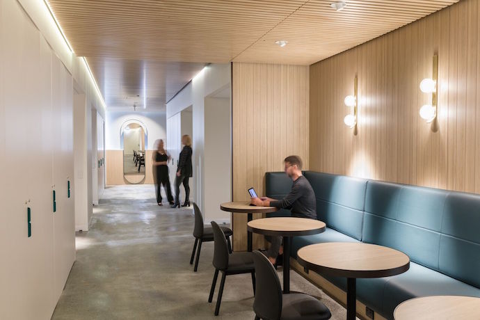 Light timber cladding, marble, brass and rich teal accents adorn the main welcome and circulation spaces, and custom features such as mirrors with marble shelving introduce luxurious focal points. Image courtesy of Daniel Shipp.