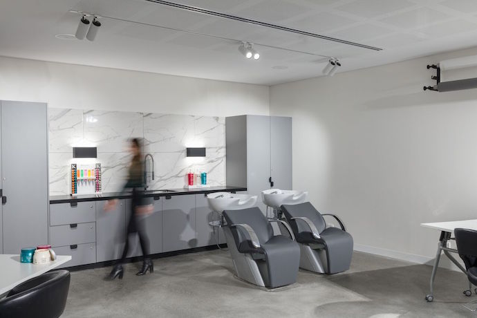 Technē Architecture + Interior Design used durable materials that could withstand the hair dyes and other products used here. Image courtesy of Daniel Shipp. 