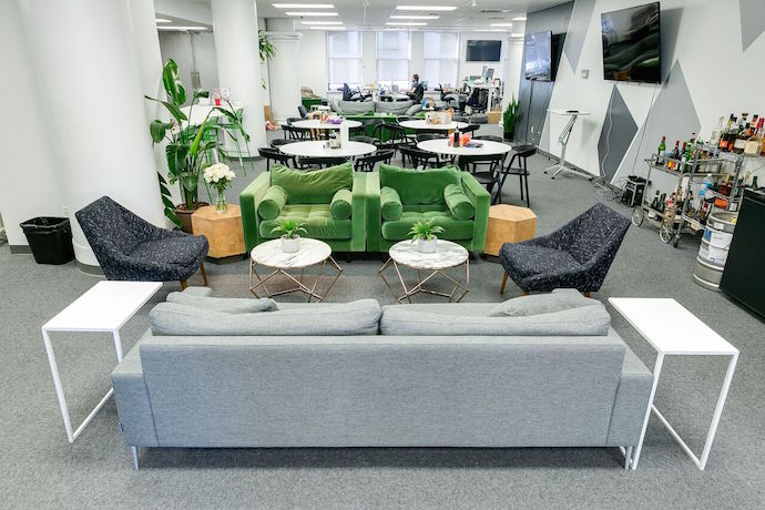 Desks were arranged in the open floor plan with attention to how each department worked. Image courtesy of Knotel.