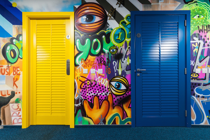 Graffiti art furthers the office's playful design. Image courtesy of nic media. 