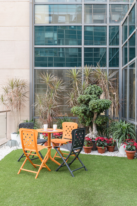 The terrace garden gives the workforce their necessary dose of fresh air and greenery. Image courtesy of PHX India. 