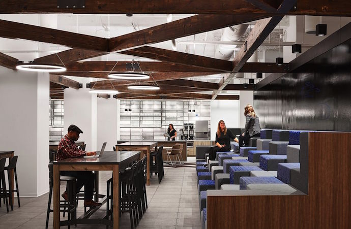 Steeped seating in the café area is used as relaxed workspace and for all-staff presentations. Image courtesy of Steve Hall and Kendall McCaugherty with Hall + Merrick Photographers.