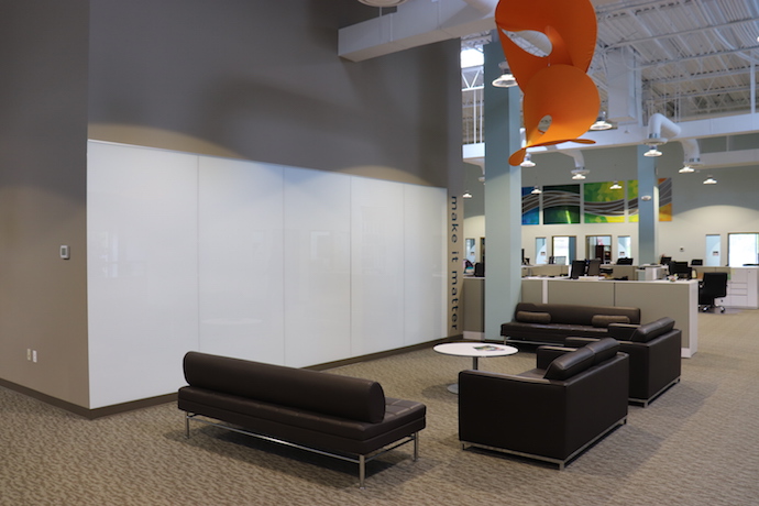 This whiteboard ideation area is a gathering space for staff--and features a hanging sculpture. Image courtesy of Cheryl Clowes.