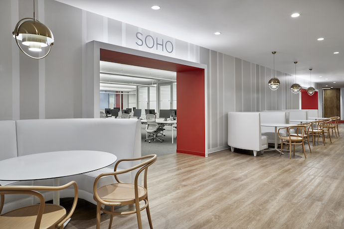 “The creation of small, distinct ‘neighborhoods’ ... helps employees navigate the office’s expansive footprint, and adds color, depth and functionality to the space,” said Jeff Knoll, a design director at Ted Moudis Associates. Image courtesy of Garrett Rowland.