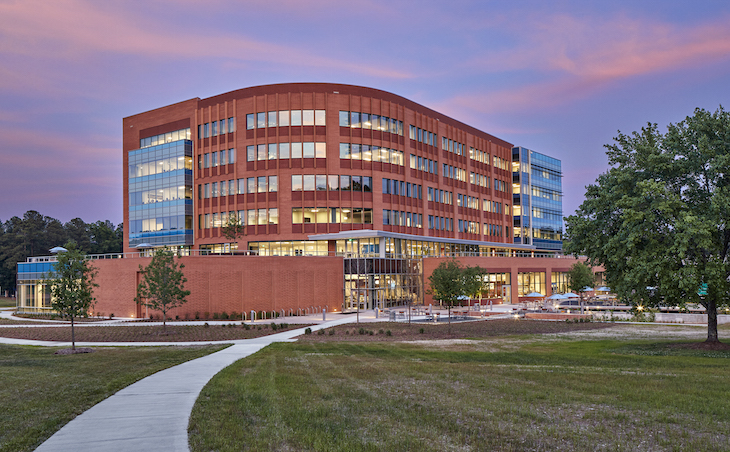 The grounds include a softball field a natural landscape that promote connection to the outdoors. Image courtesy of RTI. 