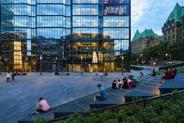 Confident triangular forms double as seating, encouraging gathering at the entrance of the Bank of Canada Museum. Image courtesy of Doublespace Photography. 